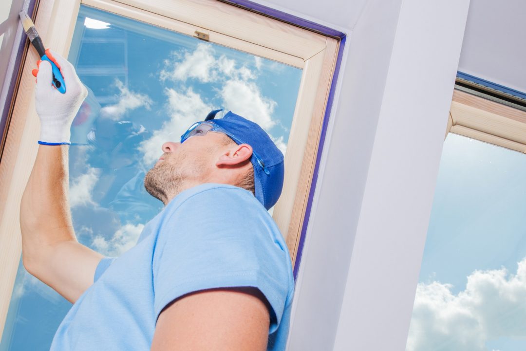WallCarePro painter finishing a window frame